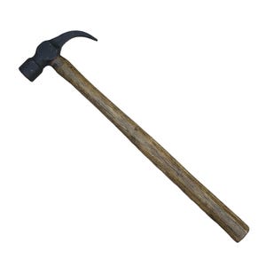 May include: A claw hammer with a black head and a wooden handle. The hammer is angled diagonally across the frame against a white background. The claw is curved, and the handle is a light brown colour.