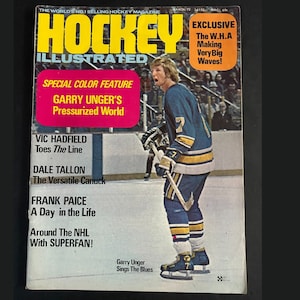 May include: Vintage "Hockey Illustrated" magazine cover featuring a hockey player in a blue and yellow uniform. The cover includes text such as "Garry Unger's Pressurized World" and "Exclusive: The W.H.A Making Very Big Waves!"