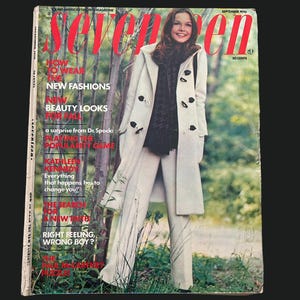 May include: Vintage Seventeen magazine cover from September 1970. The cover features a woman wearing a cream-colored coat and pants. The magazine title is in red, with text about fashion and beauty.
