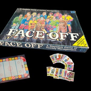 May include: A vintage "Face Off" hockey management board game. The box features colorful illustrations of hockey players and the game's title. Includes a game board, player cards, and instructions. A fun, nostalgic game.
