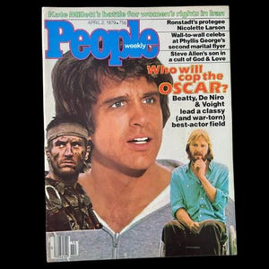 May include: A vintage People Weekly magazine cover from April 2, 1979, featuring three men. The cover has the magazine's logo in blue and the headline "Who will cop the OSCAR?" with text about Beatty, De Niro, and Voight.