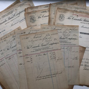 May include: A pile of vintage invoices and statements from The Canada Paint Company, with handwritten text and the company's logo. The papers are yellowed, giving them an antique appearance.