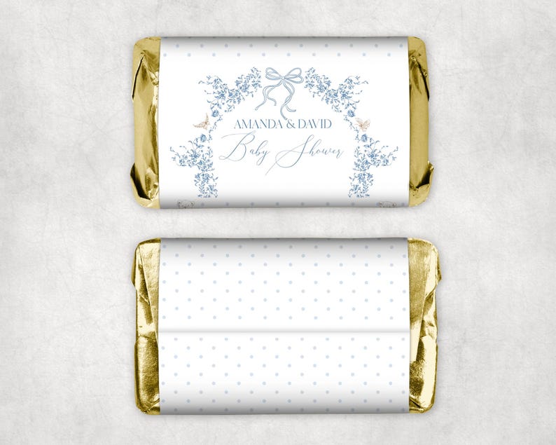 May include: Gold foil-wrapped chocolate bar with a white wrapper featuring a blue floral design and the text "Amanda & David Baby Shower". The back of the wrapper has a white background with blue polka dots.