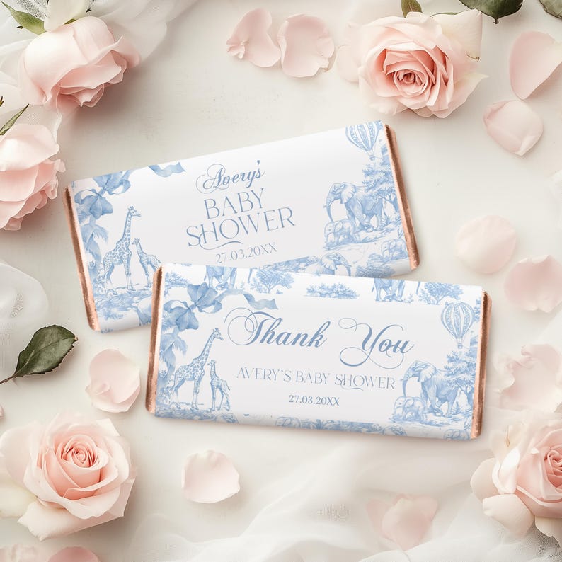 May include: Two blue and white chocolate bar wrappers with a safari animal theme. The top wrapper says "Avery's Baby Shower 27.03.20XX". The bottom wrapper says "Thank You Avery's Baby Shower 27.03.20XX".