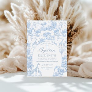 May include: A baptism invitation card with a blue and white toile design featuring elephants, giraffes, and hot air balloons. The card includes the text "Baptism of David Smith" and RSVP details. The overall theme is a celebration.
