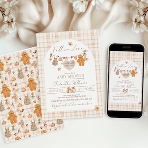 May include: Baby shower invitation set featuring a fall theme. The design includes a patterned background, a card with the text "Fall in Love," and a mobile phone displaying the same design. The invitation includes teddy bears, pumpkins, and leaves.