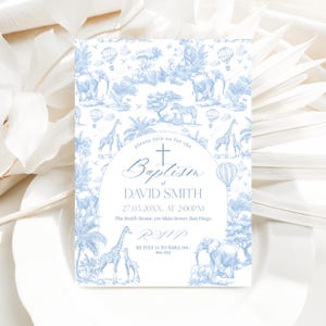 May include: A light blue baptism invitation with a safari animal toile pattern. The invitation includes the text "Baptism of DAVID SMITH" and event details. The design features giraffes, elephants, zebras, lions, and hot air balloons.