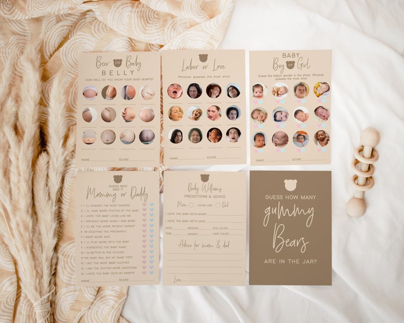 May include: A set of printable baby shower game cards with a brown and beige color scheme. The cards feature a bear illustration and text such as "Beer Belly", "Labor or Love", "Baby Boy or Girl", "Mommy or Daddy", "Baby Williams Predictions & Advice", and "Guess How Many Gummy Bears Are in the Jar?"
