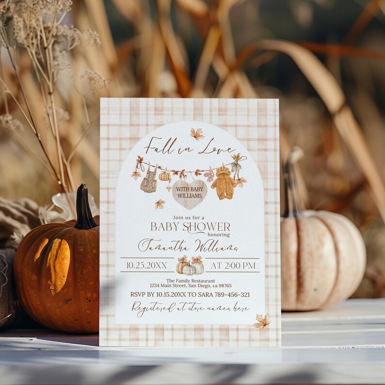 May include: Baby shower invitation with a fall theme. The invitation features the text "Fall in Love" and "Baby Shower" with decorative elements like leaves and a teddy bear. The background has a plaid pattern.