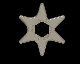 May include: A silver-toned star-shaped wrench with a hexagonal hole in the center. The wrench has markings for different sizes: 5/16, 3/8, 7/16, 1/2, 9/16, 5/8, 11/16, and 3/4 inches.
