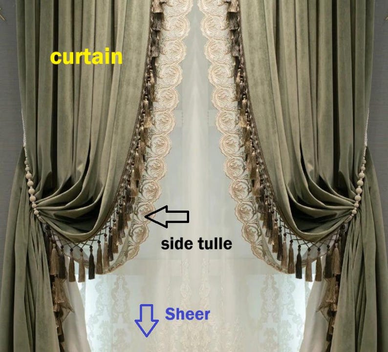 May include: Olive green velvet curtains with decorative tassels and beaded tiebacks. The curtains frame a sheer, light-colored side tulle with an embroidered floral design. The overall style is elegant and classic.