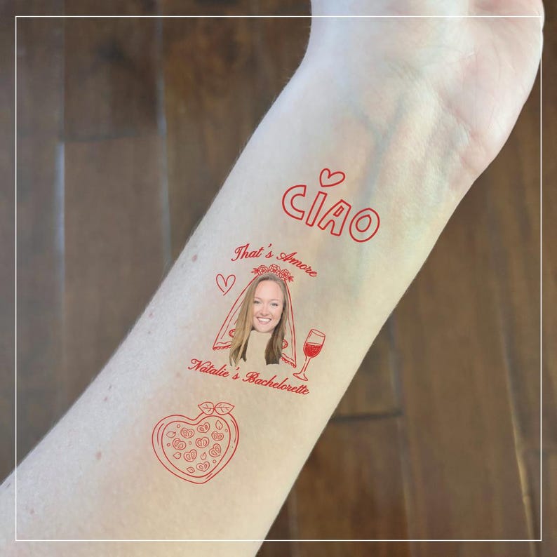 May include: Red temporary tattoo with the word "CIAO" and the phrase "That's Amore". Includes a portrait of a woman in a veil, a wine glass, and a heart-shaped pizza. The tattoo is designed for a bachelorette party.