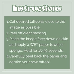 May include: A square image with instructions for applying a temporary tattoo. The word "Instructions" is at the top. Steps include cutting the tattoo, peeling the backing, applying to skin, and removing the paper. The background is sage green.