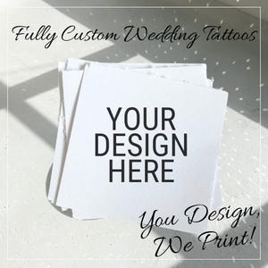 May include: A stack of white square cards with the text "YOUR DESIGN HERE" in bold black letters. The cards are for custom wedding tattoos. The image also includes the text "Fully Custom Wedding Tattoos" and "You Design, We Print!"