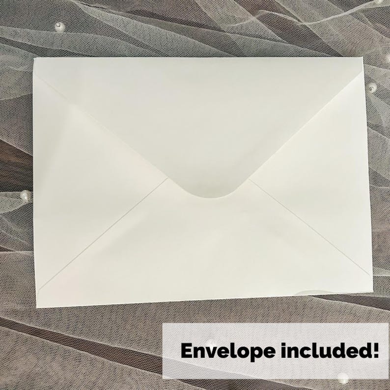 May include: A white envelope with a pointed flap, lying on a textured surface. The text "Envelope included!" is displayed in a white rectangle at the bottom of the image. The envelope is a standard size.
