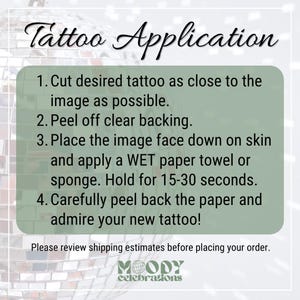 May include: A rectangular sage green instructional sign with black text titled Tattoo Application. It lists four steps for applying temporary tattoos, including cutting the image, peeling the backing, applying with a wet towel, and peeling the paper.