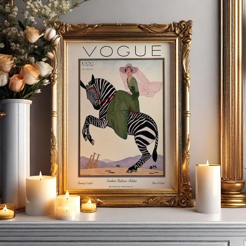 Digitally restored 1926 Vogue magazine cover titled Southern Fashions Number, featuring a stylish woman in a flowing green dress and pink hat riding a zebra in a desert landscape with giraffes and mountains. Vintage Art Deco fashion illustration digital download ideal for gallery walls, eclectic decor, and gifts for fashion history and vintage art lovers.
