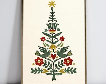 May include: A framed print featuring a stylized Christmas tree design. The tree is composed of green, red, and yellow floral and bird motifs on a cream background. The text "VINTAGE CHARM CORNER" is at the bottom.