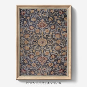 May include: A framed print of a vintage floral pattern in shades of blue, red, and yellow. The pattern is intricate and detailed, with a repeating motif of flowers and leaves. The frame is a simple wooden frame with a light brown finish.