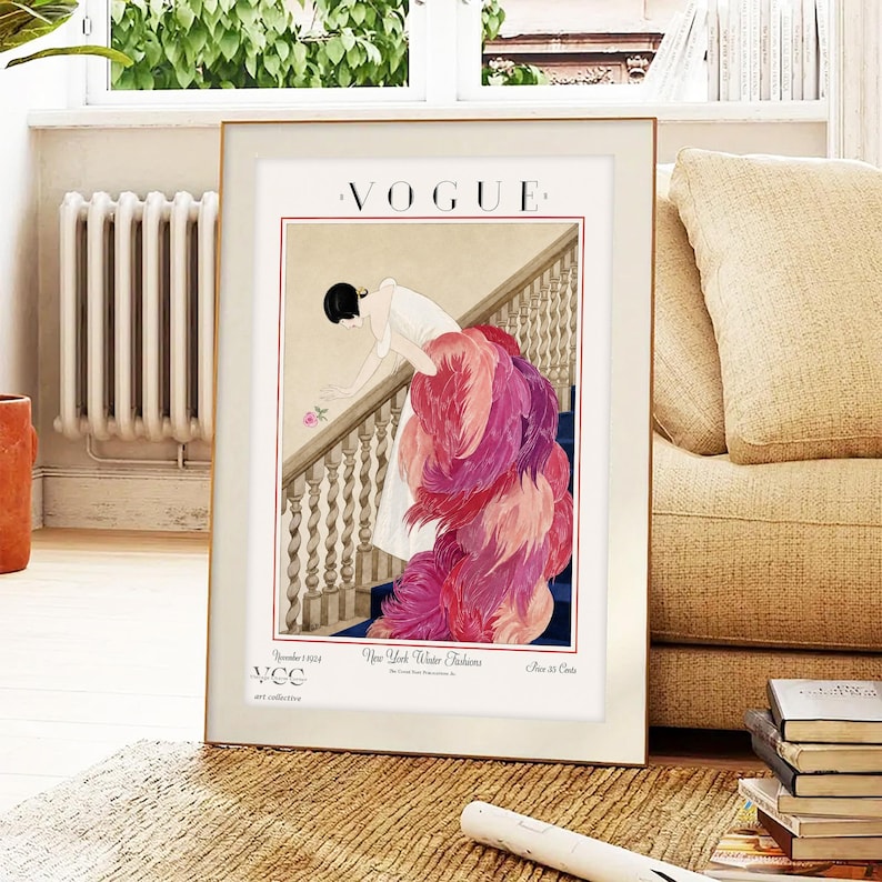 Digital Download Of A November 1 1924 Vogue Cover By George Wolfe Plank Showing An Art Deco Woman In A White Winter Gown Leaning Over A Staircase Toward A Pink Rose With Dramatic Pink Feathered Train. Printable Vintage Wall Decor For Cottagecore Farmhouse Glam Gallery Walls Fashion History Lovers And Gift Buyers.