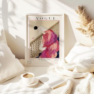 Digital Download Of A November 1 1924 Vogue Cover By George Wolfe Plank Showing An Art Deco Woman In A White Winter Gown Leaning Over A Staircase Toward A Pink Rose With Dramatic Pink Feathered Train. Printable Vintage Wall Decor For Cottagecore Farmhouse Glam Gallery Walls Fashion History Lovers And Gift Buyers.