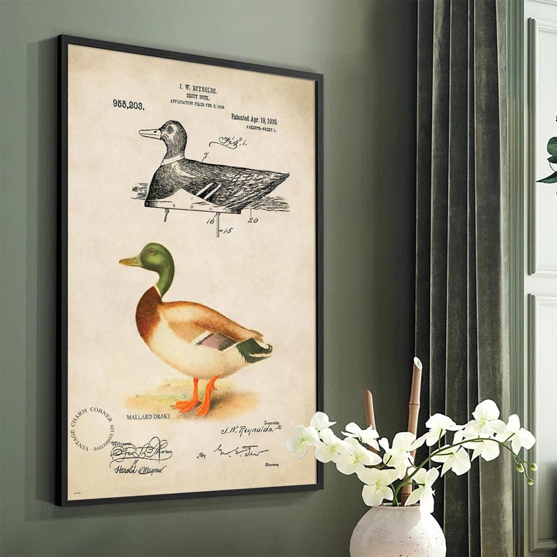 Vintage duck decoy wall art featuring a 1910 patent sketch and watercolor illustration of a mallard drake. Perfect for farmhouse, rustic, lodge, or hunting-themed decor. This antique bird print is a high-resolution digital download for instant use. Ideal for vintage art lovers, birdwatchers, or as a Father's Day gift. Styled for cottagecore, nature-inspired, or Americana interiors. Unique historical artwork to enhance your space with charm and character.