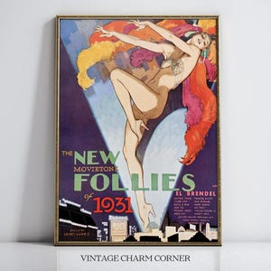 May include: Vintage framed poster for "The New Movieton Follies of 1931." The artwork features a nude dancer with colorful feathers, set against a purple background with city silhouettes and text. The poster is in a gold frame.