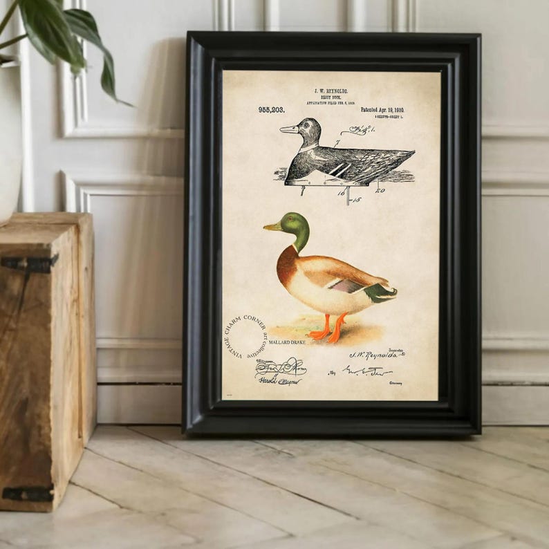 Vintage duck decoy wall art featuring a 1910 patent sketch and watercolor illustration of a mallard drake. Perfect for farmhouse, rustic, lodge, or hunting-themed decor. This antique bird print is a high-resolution digital download for instant use. Ideal for vintage art lovers, birdwatchers, or as a Father's Day gift. Styled for cottagecore, nature-inspired, or Americana interiors. Unique historical artwork to enhance your space with charm and character.