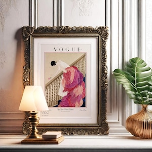 Digital Download Of A November 1 1924 Vogue Cover By George Wolfe Plank Showing An Art Deco Woman In A White Winter Gown Leaning Over A Staircase Toward A Pink Rose With Dramatic Pink Feathered Train. Printable Vintage Wall Decor For Cottagecore Farmhouse Glam Gallery Walls Fashion History Lovers And Gift Buyers.