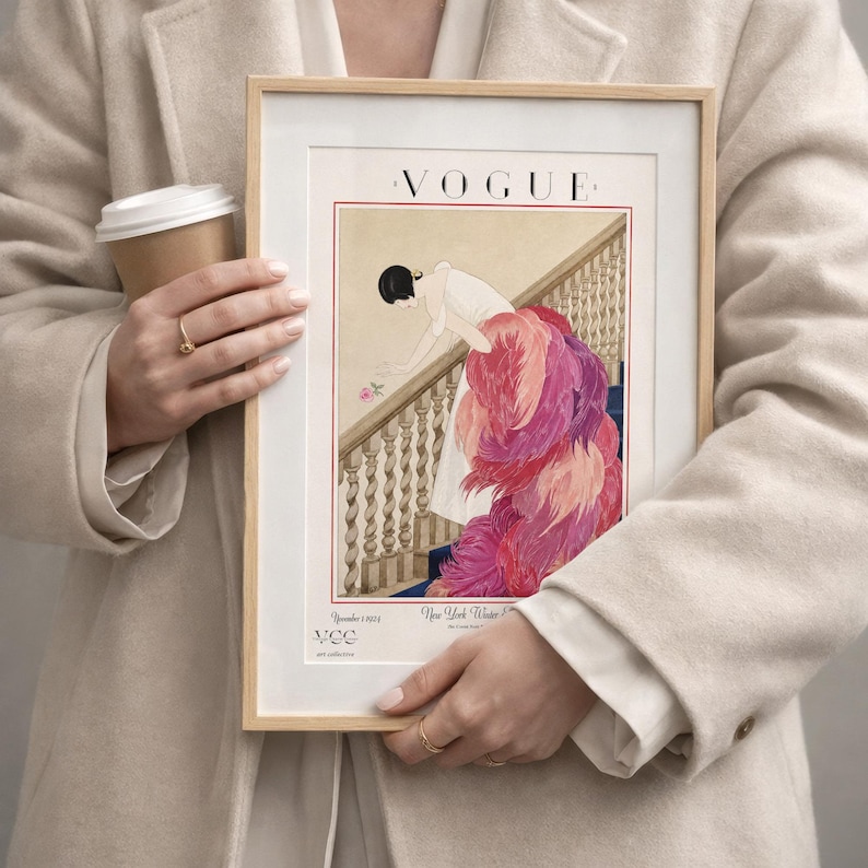Digital Download Of A November 1 1924 Vogue Cover By George Wolfe Plank Showing An Art Deco Woman In A White Winter Gown Leaning Over A Staircase Toward A Pink Rose With Dramatic Pink Feathered Train. Printable Vintage Wall Decor For Cottagecore Farmhouse Glam Gallery Walls Fashion History Lovers And Gift Buyers.