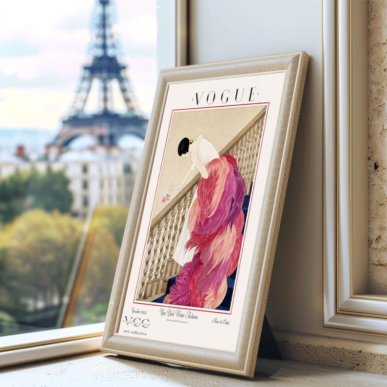Digital Download Of A November 1 1924 Vogue Cover By George Wolfe Plank Showing An Art Deco Woman In A White Winter Gown Leaning Over A Staircase Toward A Pink Rose With Dramatic Pink Feathered Train. Printable Vintage Wall Decor For Cottagecore Farmhouse Glam Gallery Walls Fashion History Lovers And Gift Buyers.