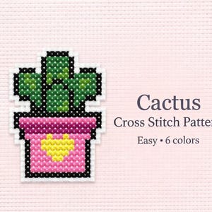 Può includere: Un modello a punto croce di un cactus in un vaso rosa con un cuore giallo. Il cactus è verde e il vaso ha un contorno nero. Il testo recita "Cactus Cross Stitch Pattern Easy • 6 colori."