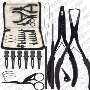 May include: A set of black hair tools in a black zippered case. The set includes a variety of tools, including pliers, scissors, clips, and a needle threader.