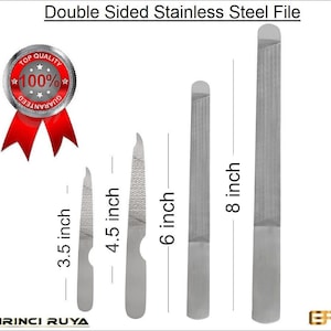 May include: Set of four double-sided stainless steel nail files in different sizes: 3.5 inches, 4.5 inches, 6 inches, and 8 inches.  The files are silver and have a textured surface.