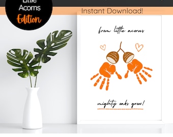 May include: Printable handprint art with the text "from little acorns mighty oaks grow!" and two orange handprints with brown acorns on top.