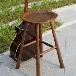 Guitar stand / performance stool, made of walnut for acoustic guitars.