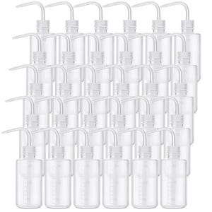 May include: A collection of clear, plastic wash bottles with white caps and curved spouts. Each bottle has graduated markings for measuring liquids. The bottles are arranged in neat rows, suggesting a laboratory or scientific setting.