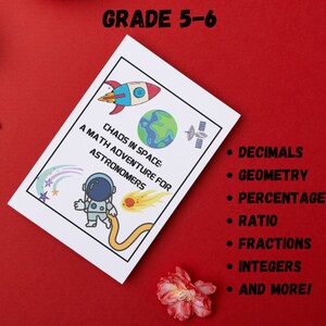 May include: A white card with a cartoon astronaut and a rocket ship. The text on the card reads "Chaos in Space: A Math Adventure for Astronomers". The card also lists math topics covered, including decimals, geometry, percentage, ratio, fractions, integers, and more.