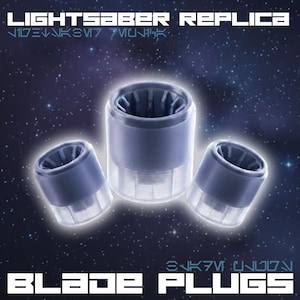 May include: Three blue and clear lightsaber blade plugs are displayed against a starry background. The text "LIGHTSABER REPLICA" and "BLADE PLUGS" are visible. The plugs have a cylindrical shape with a detailed interior.