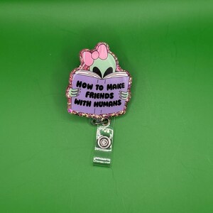 Funny Alien Badge Reel – “How to Make Friends with Humans” Glitter Retractable ID Holder for Nurses, Teachers, & Coworkers