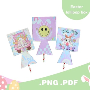 Puede incluir: Tres cajas de piruletas con temática de Pascua con diseños de conejos y flores. Una caja presenta un conejito conduciendo un coche con el texto "Happy Easter". Otra tiene una carita sonriente y el texto "Don't worry be hoppy". La tercera dice "Too hip to hop".
