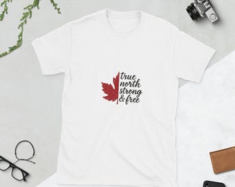 May include: White t-shirt with a red maple leaf and the text "true north strong & free" printed on the front.