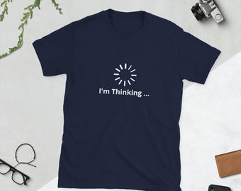 May include: A navy blue t-shirt with a white loading icon and the text "I'm Thinking..." printed on the front.