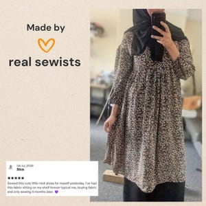 May include: A midi dress featuring a black base with a small white and brown floral pattern, long sleeves, and a gathered waist. The image includes text that reads Made by real sewists and a review dated 04 Jul, 2026 by Silvia about the dress.