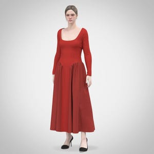 May include: A woman wearing a long, red dress with a fitted bodice and a flowing skirt. The dress has a scoop neckline and long sleeves.