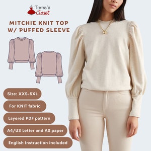 May include: A digital illustration of a knit top with puffed sleeves. The top is shown in a light pink color. The text "MITCHIE KNIT TOP W/ PUFFED SLEEVE" is at the top of the image. The text "Size: XXS-5XL" is below the illustration. The text "For KNIT fabric" is below the size text. The text "Layered PDF pattern" is below the fabric text. The text "A4/US Letter and A0 paper" is below the pattern text. The text "English Instruction included" is below the paper text. A photo of a woman wearing a similar top in a light beige color is shown on the right side of the image.
