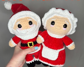 May include: Two crocheted plush dolls representing Santa Claus and Mrs. Claus, featuring red and white yarn, black safety eyes, and pink cheeks. Santa wears a hat and belt with a yellow buckle. Text reads: PDF PATTERN ONLY HOLIDAY BUNDLE.