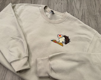 Anime-inspired embroidered pullover sweater