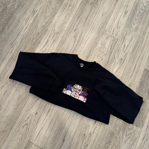Anime-inspired embroidered pullover sweater