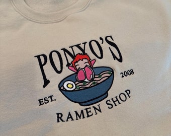 Anime-inspired embroidered pullover sweater